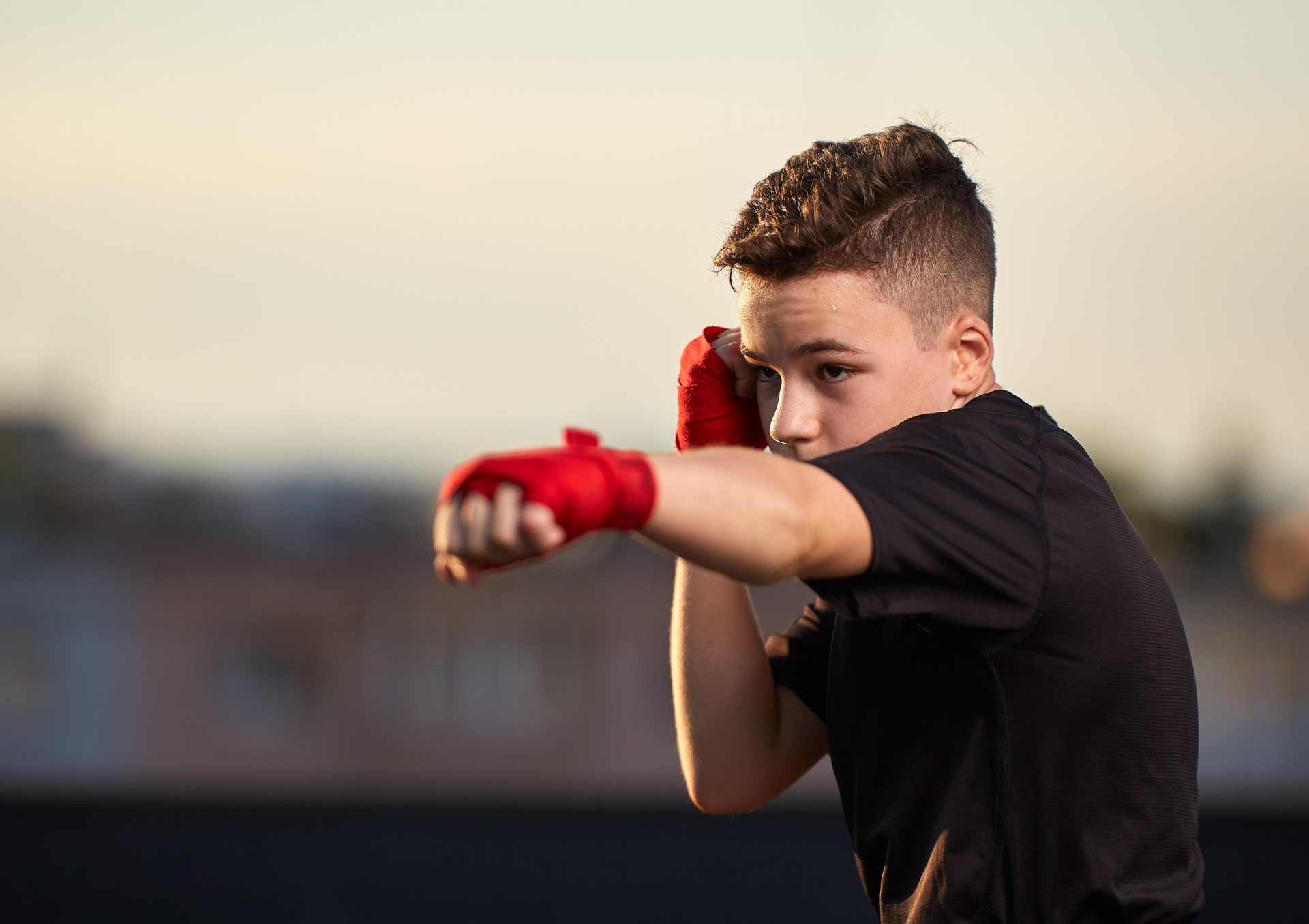 Young fighter training on the roof